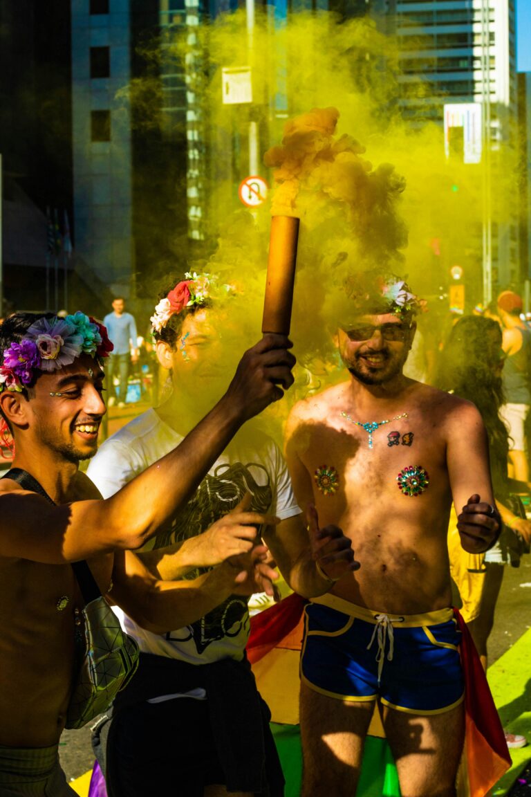 Colorful parade in São Paulo featuring joyful participants with floral accessories.